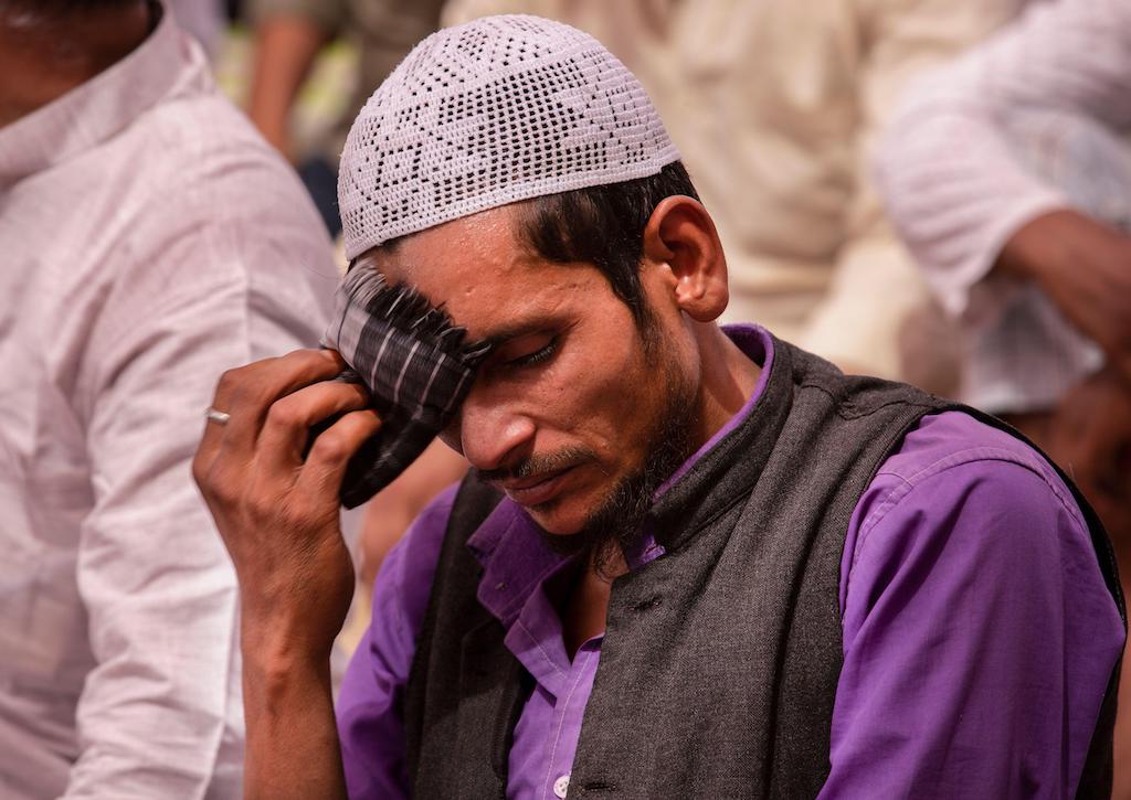 A man wipes sweat off his brow on a hot day in New Delhi, as South Asia was gripped by a blistering spring heatwave in 2022.