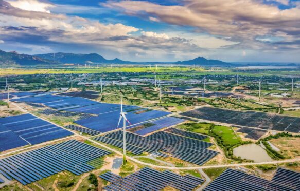 Aerial view of solar panels and wind turbines in Vietnam. Credit: Quang Ngoc Nguyen / Alamy Stock Photo