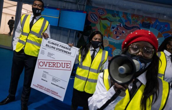 Protest inside the COP26 venue, Glasgow, Scotland, 11 November 2021.