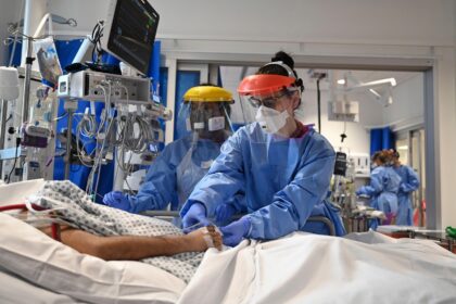 Medical personnel tend to a patient with COVID-19 in intensive care Cambridge, UK.