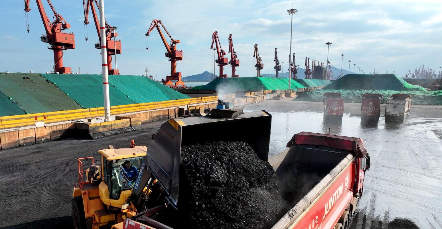 Transport vehicles transfer coal a terminal in Jiangsu, China.