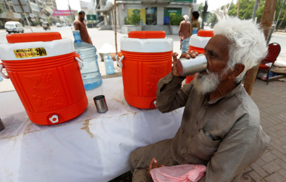 A water distribution point during a heatwave in Karachi, Pakistan.