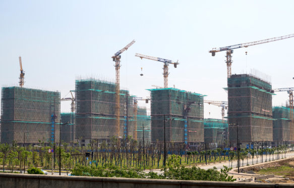 New apartments under construction in Yangzhou, Jiangsu, China. Credit: Charles O. Cecil / Alamy Stock Photo.