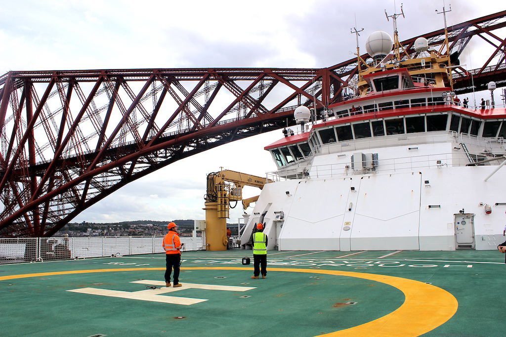 View from the helipad as the Sir David Attenborough passes under the Forth Bridge in east Scotland. 