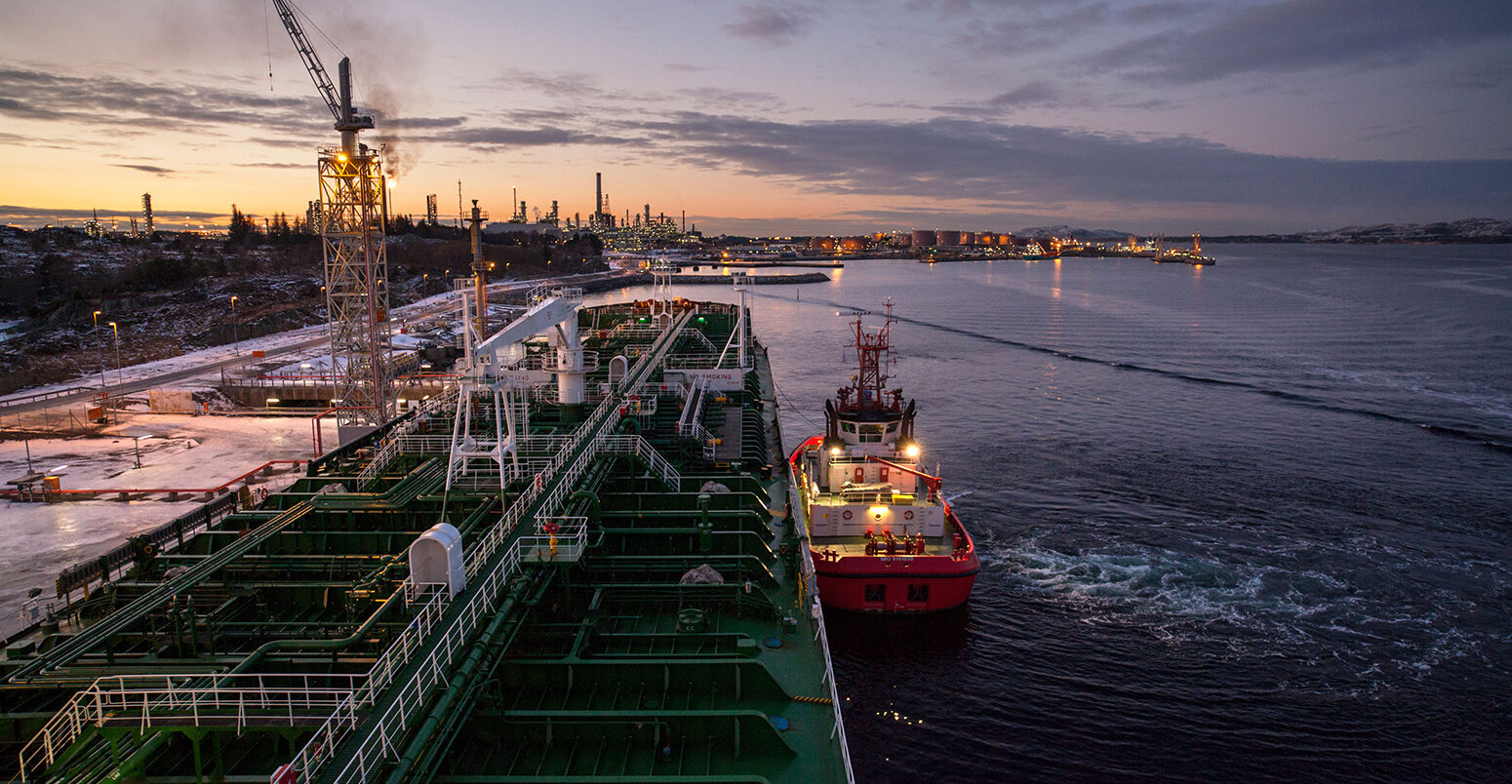 An oil tanker being moored at the Mongstad oil terminal and refinery in Norway. Credit: Ola Moen / Alamy Stock Photo. D1AJ6D